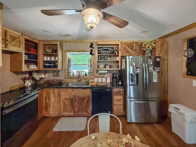 kitchen with appliances with stainless steel finishes, a sink, open shelves, and dark wood-type flooring