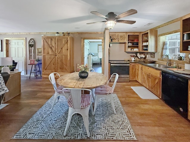 dining room with light wood-style floors and ceiling fan