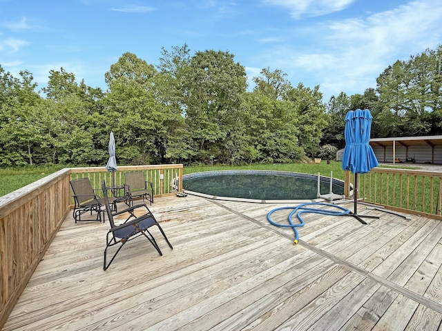 deck featuring view of scattered trees
