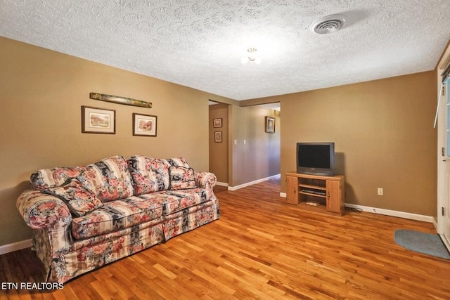 1729 Roslin Rd, Jamestown, TN 38556 - living area with wood finished floors and a textured ceiling