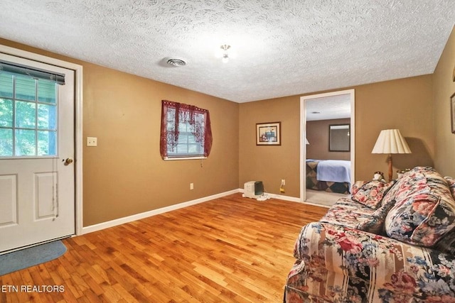 1729 Roslin Rd, Jamestown, TN 38556 - living area with a textured ceiling and light wood-type flooring