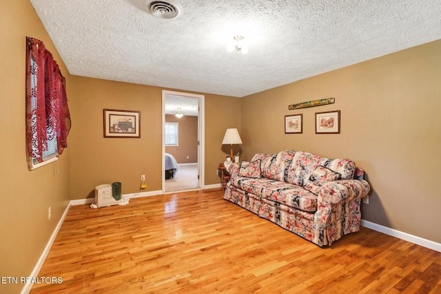 1729 Roslin Rd, Jamestown, TN 38556 - living area featuring a textured ceiling and wood finished floors