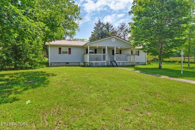 1729 Roslin Rd, Jamestown, TN 38556 - single story home featuring a porch, crawl space, a front yard, and a metal roof