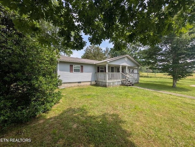 1729 Roslin Rd, Jamestown, TN 38556 - view of front facade with covered porch, crawl space, a front lawn, and a metal roof