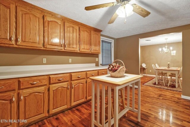 1729 Roslin Rd, Jamestown, TN 38556 - kitchen with dark wood-style flooring, a textured ceiling, and brown cabinets