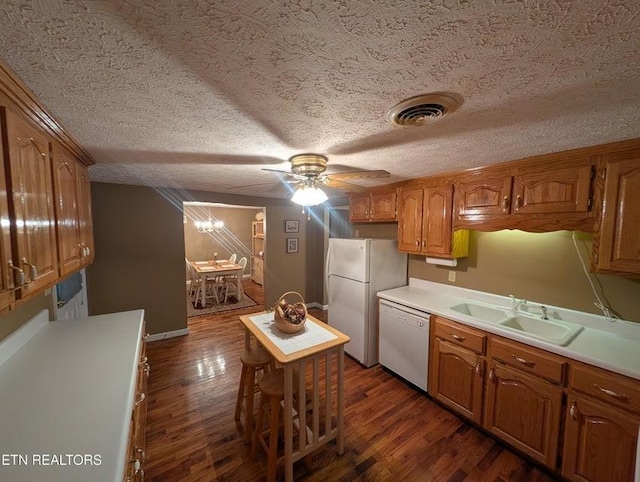 1729 Roslin Rd, Jamestown, TN 38556 - kitchen featuring white appliances, dark wood-style flooring, brown cabinets, a ceiling fan, and a textured ceiling