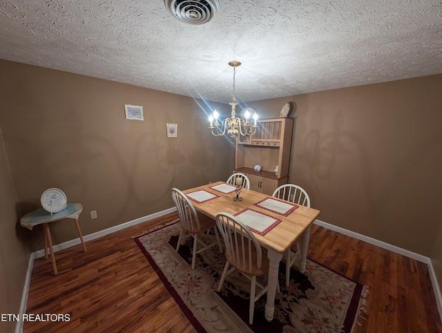 1729 Roslin Rd, Jamestown, TN 38556 - dining area featuring wood finished floors, a chandelier, and a textured ceiling