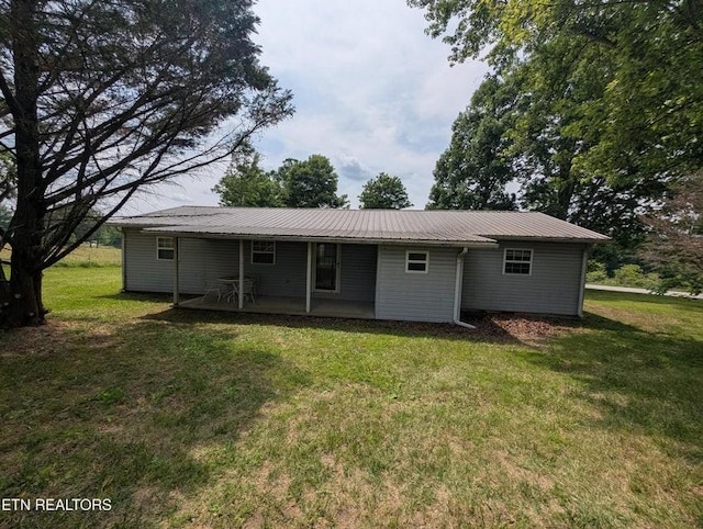 1729 Roslin Rd, Jamestown, TN 38556 - back of property featuring a yard and a metal roof