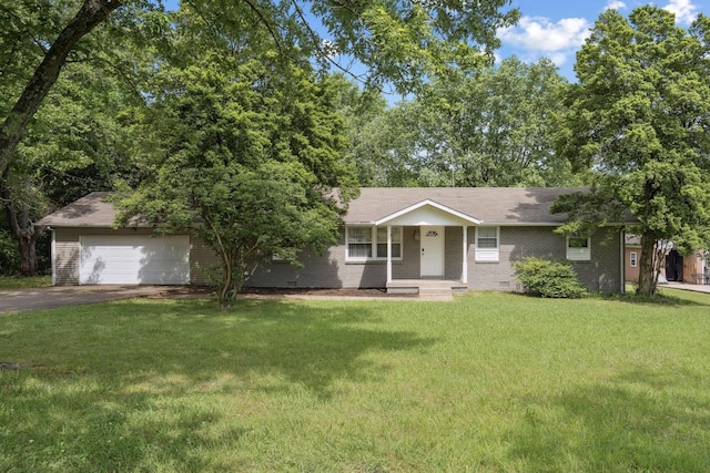 view of front of house featuring a front yard, driveway, and brick siding