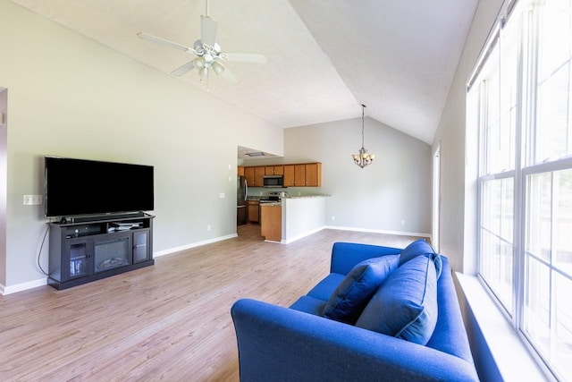309 Yacht Ct, Smyrna, TN 37167 - living area featuring a chandelier, light wood finished floors, baseboards, a ceiling fan, and high vaulted ceiling