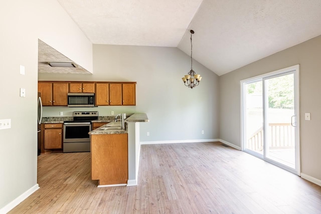 309 Yacht Ct, Smyrna, TN 37167 - kitchen with stainless steel appliances, brown cabinetry, a sink, a chandelier, and light wood finished floors