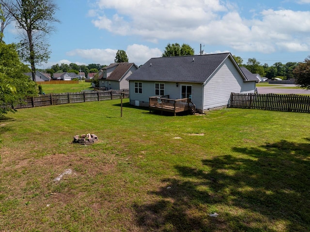 309 Yacht Ct, Smyrna, TN 37167 - back of property featuring a wooden deck and an outdoor fire pit