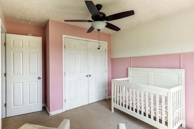 309 Yacht Ct, Smyrna, TN 37167 - bedroom featuring a closet, carpet flooring, a ceiling fan, a nursery area, and baseboards