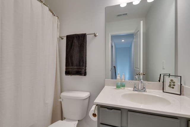 full bath with toilet and vanity