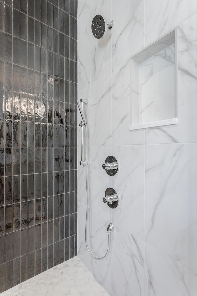full bathroom featuring tiled shower