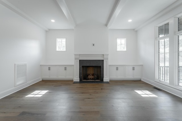 unfurnished living room featuring beamed ceiling, hardwood / wood-style floors, a fireplace with flush hearth, baseboards, and recessed lighting
