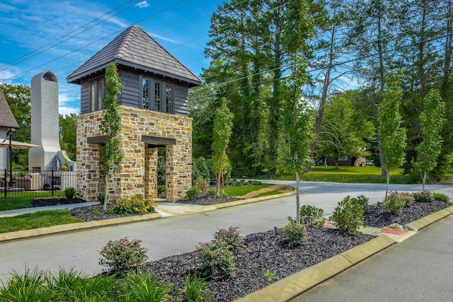 exterior space featuring fence and driveway