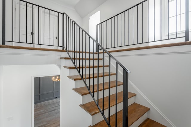 stairway featuring wood finished floors
