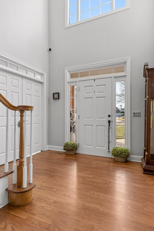 9727 Chestnut Hill Ln, Chattanooga, TN 37421 - entryway with a high ceiling, light wood-type flooring, stairs, and baseboards