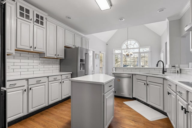 9727 Chestnut Hill Ln, Chattanooga, TN 37421 - kitchen featuring stainless steel appliances, a sink, lofted ceiling, a chandelier, and backsplash
