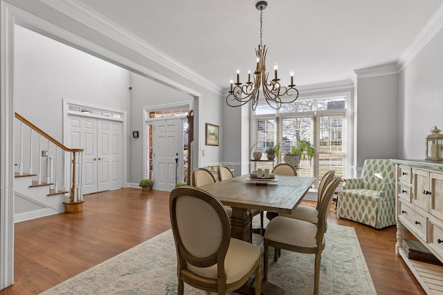 9727 Chestnut Hill Ln, Chattanooga, TN 37421 - dining space with a chandelier, ornamental molding, dark wood-style flooring, and stairs
