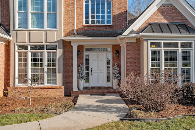 9727 Chestnut Hill Ln, Chattanooga, TN 37421 - view of exterior entry featuring brick siding and a standing seam roof