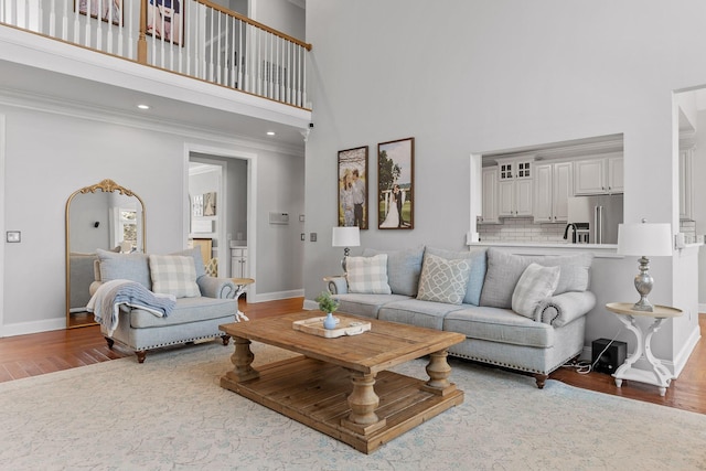 9727 Chestnut Hill Ln, Chattanooga, TN 37421 - living room with a high ceiling, wood finished floors, baseboards, ornamental molding, and recessed lighting