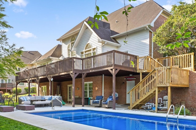 9727 Chestnut Hill Ln, Chattanooga, TN 37421 - back of property with an outdoor hangout area, a wooden deck, an outdoor pool, stairway, and brick siding
