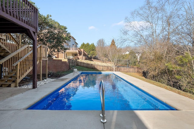 9727 Chestnut Hill Ln, Chattanooga, TN 37421 - view of swimming pool with stairway, a fenced backyard, and a deck