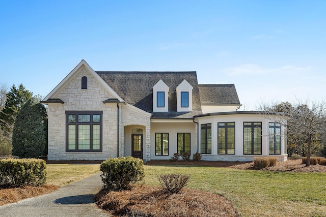 9727 Chestnut Hill Ln, Chattanooga, TN 37421 - view of front of house featuring stone siding, roof with shingles, and a front lawn