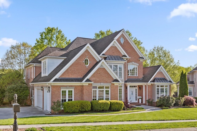 9727 Chestnut Hill Ln, Chattanooga, TN 37421 - traditional-style house with concrete driveway, brick siding, and a front yard