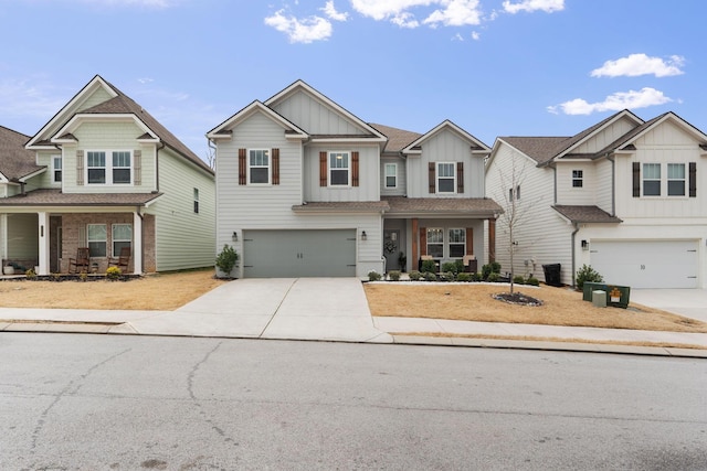 7587 Highborne Ln, Ooltewah, TN 37363 - craftsman-style house featuring board and batten siding, an attached garage, driveway, and covered porch