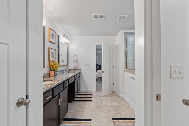 7587 Highborne Ln, Ooltewah, TN 37363 - ensuite bathroom featuring double vanity, a walk in shower, baseboards, and marble finish flooring