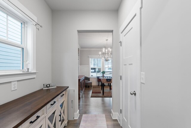 7587 Highborne Ln, Ooltewah, TN 37363 - hallway featuring a chandelier and dark wood finished floors
