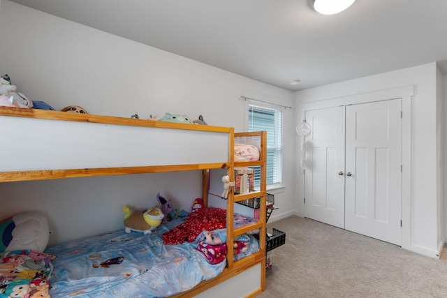 7587 Highborne Ln, Ooltewah, TN 37363 - bedroom with light carpet, a closet, and baseboards