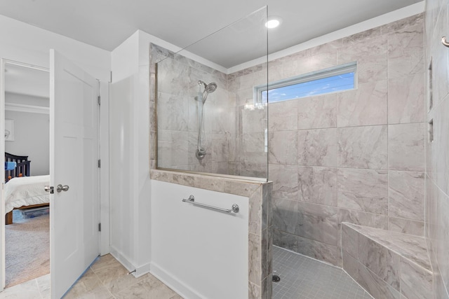 7587 Highborne Ln, Ooltewah, TN 37363 - ensuite bathroom featuring a walk in shower and marble look tile flooring