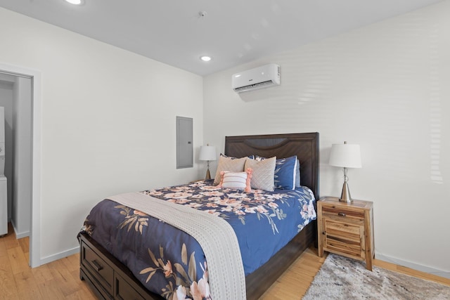 121 Old Mountain Rd, Chattanooga, TN 37409 - bedroom featuring a wall mounted AC, baseboards, light wood finished floors, recessed lighting, and electric panel