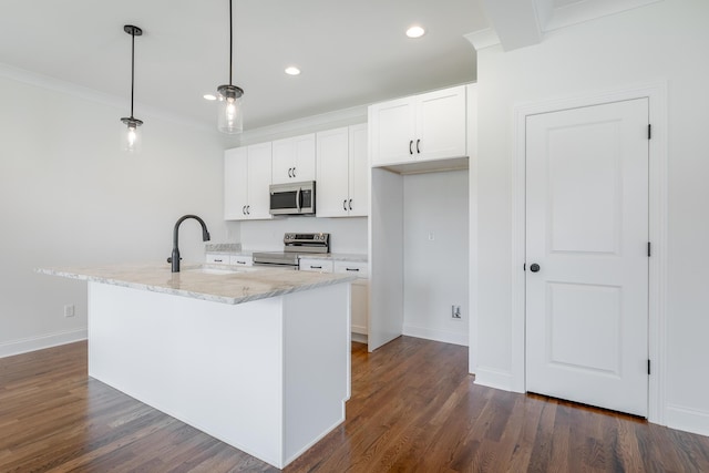 5008 Swan Rd, Chattanooga, TN 37416 - kitchen featuring appliances with stainless steel finishes, white cabinetry, light stone counters, pendant lighting, and dark wood-style floors