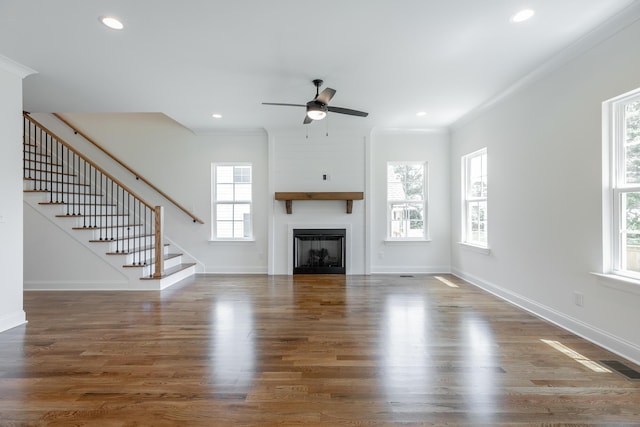 5008 Swan Rd, Chattanooga, TN 37416 - unfurnished living room with healthy amount of natural light, stairs, a ceiling fan, ornamental molding, and a fireplace