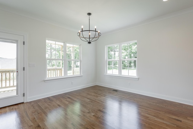5008 Swan Rd, Chattanooga, TN 37416 - empty room featuring healthy amount of natural light, a chandelier, crown molding, and dark wood-style floors