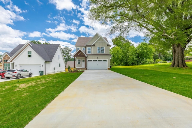 5008 Swan Rd, Chattanooga, TN 37416 - view of front of property featuring board and batten siding, driveway, a front yard, and an attached garage