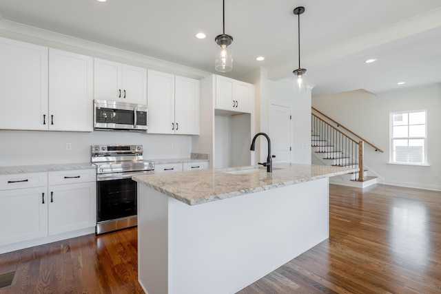 5008 Swan Rd, Chattanooga, TN 37416 - kitchen featuring appliances with stainless steel finishes, white cabinets, dark wood finished floors, recessed lighting, and light stone counters