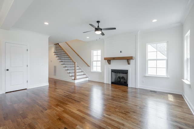 5008 Swan Rd, Chattanooga, TN 37416 - unfurnished living room featuring a ceiling fan, stairway, a large fireplace, crown molding, and wood finished floors