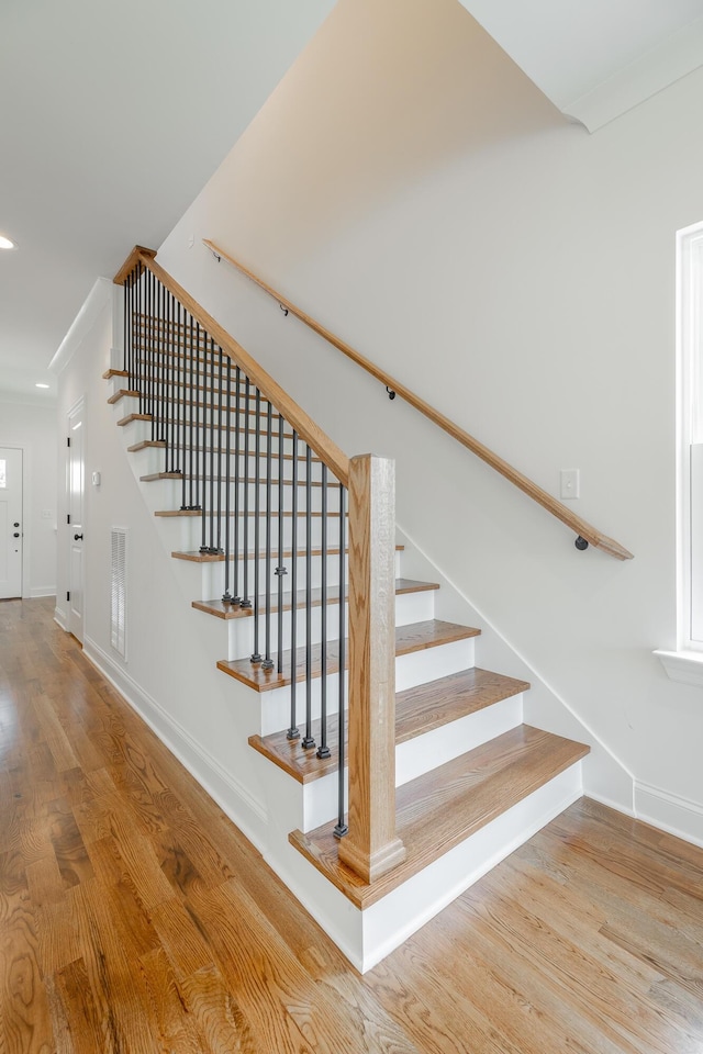 5008 Swan Rd, Chattanooga, TN 37416 - staircase featuring wood finished floors, ornamental molding, and recessed lighting