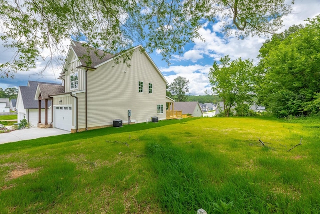 5008 Swan Rd, Chattanooga, TN 37416 - view of home's exterior with concrete driveway, board and batten siding, a lawn, and a garage