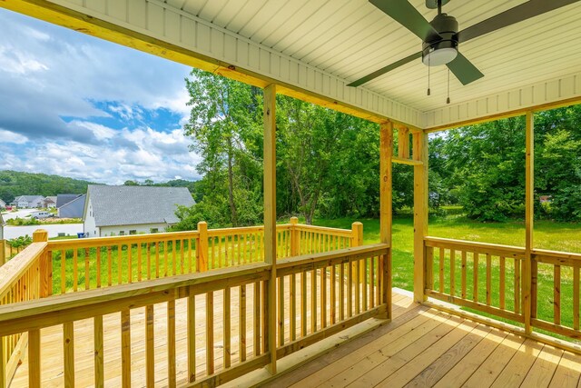5008 Swan Rd, Chattanooga, TN 37416 - wooden terrace with a ceiling fan, a yard, and view of wooded area
