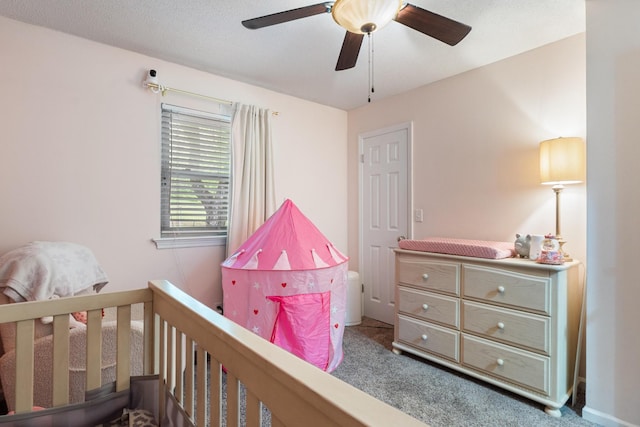 carpeted bedroom with ceiling fan