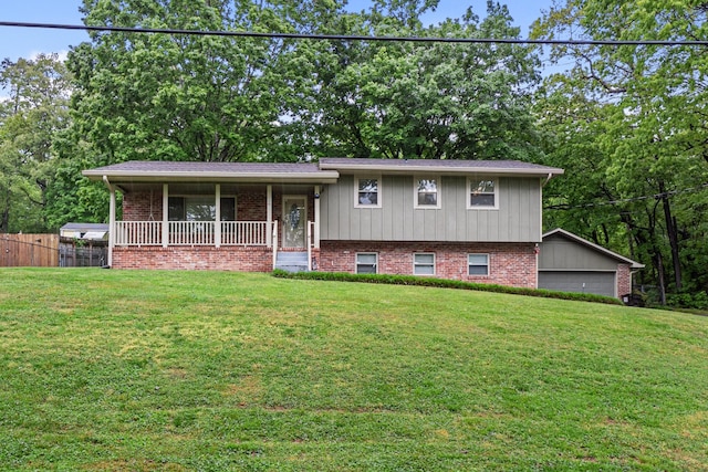 split level home featuring a porch and brick siding