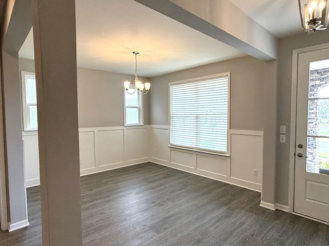 122 Blake Ln, Mount Juliet, TN 37122 - foyer featuring a chandelier, a decorative wall, wainscoting, dark wood-style flooring, and healthy amount of natural light