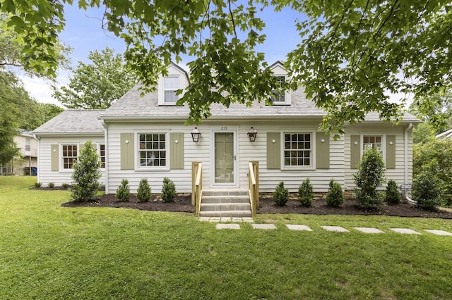 215 Lewisburg Ave, Franklin, TN 37064 - cape cod house featuring a front yard and roof with shingles